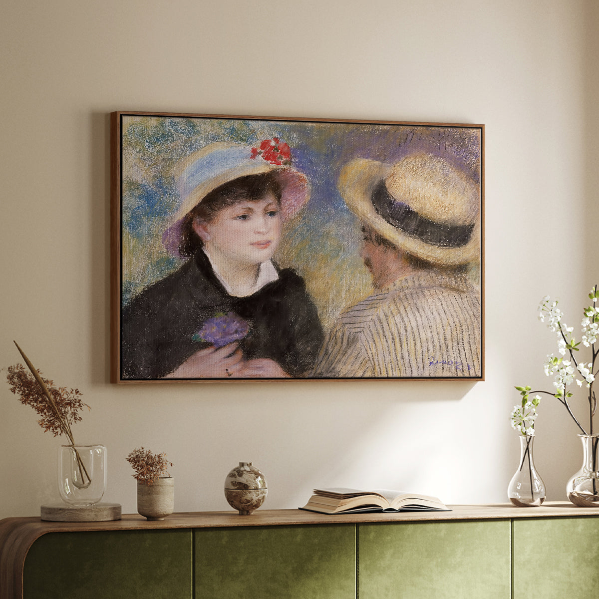 Walnut floater framed canvas of Boating Couple (Aline Charigot and Renoir), c. 1881 by Pierre-Auguste Renoir, featuring an intimate portrait of man and woman sitting side by side in outdoor setting above a sideboard in a softly lit hallway.