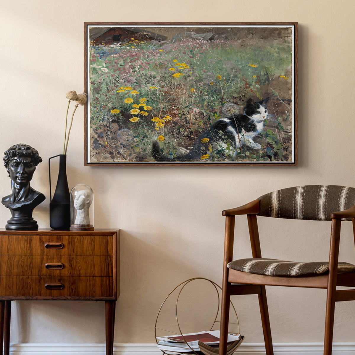 Cat on a Flowery Meadow, 1887 by Bruno Liljefors as a walnut floater framed canvas featuring an animal scene of cat hidden in lush meadow vegetation, styled above a mid-century console in a contemporary living area.