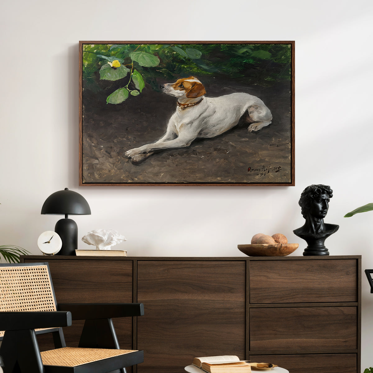 Portrait of a Dog, 1891 by Bruno Liljefors displayed in a walnut floater framed canvas above a dark wood credenza in an entryway.