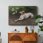 Portrait of a Dog, 1891 by Bruno Liljefors in a walnut floater framed canvas featuring a dog lying on ground with head raised in natural outdoor setting, displayed above a wood console cabinet.