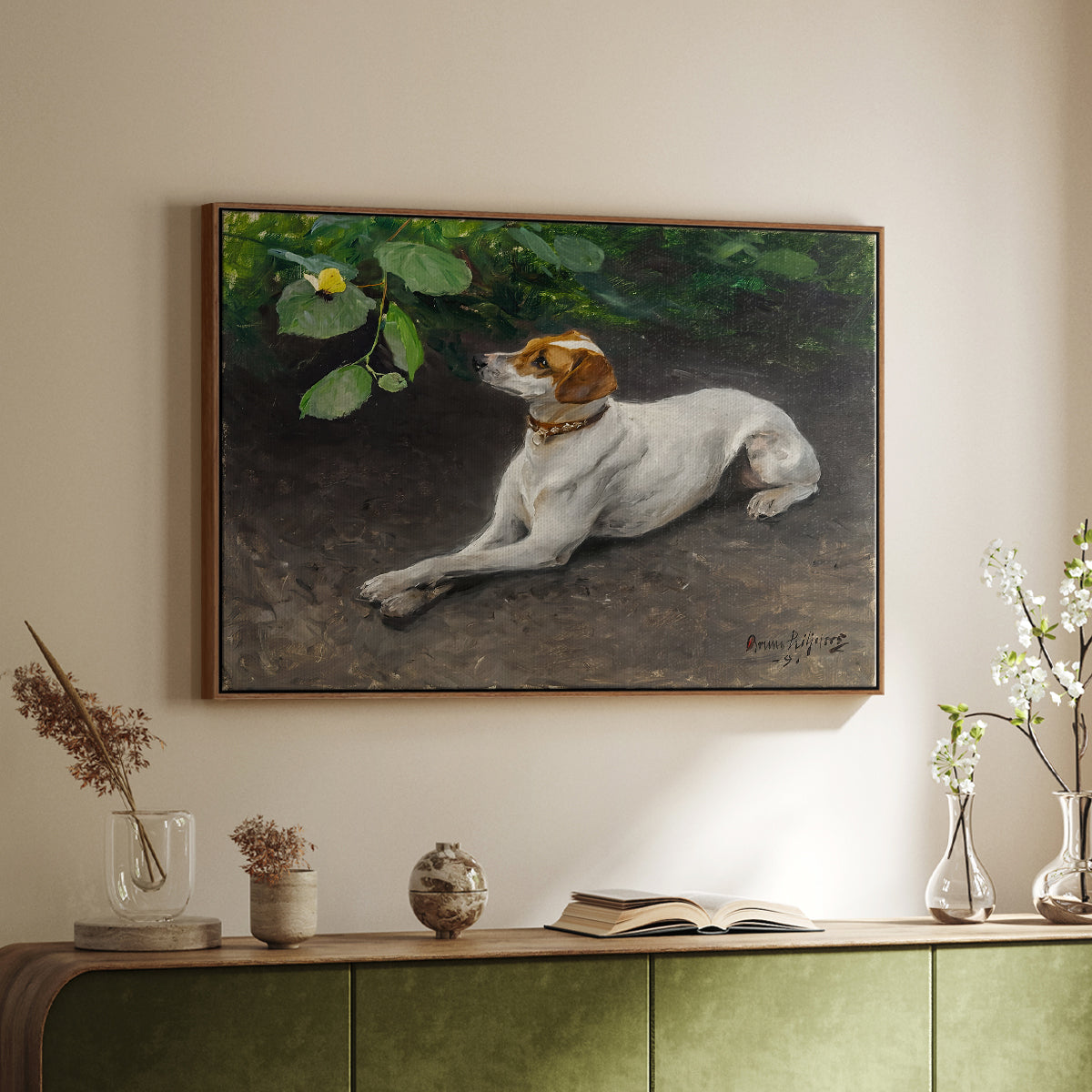 Walnut floater framed canvas of Portrait of a Dog, 1891 by Bruno Liljefors, featuring a realistic portrait of a resting dog with attentive expression above a sideboard in a softly lit hallway.