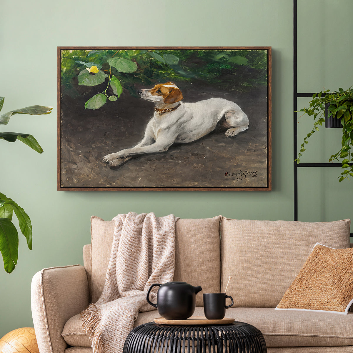 Walnut floater framed canvas featuring a calm scene of dog reclining in open landscape, displayed above a sofa in a modern living room.