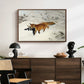 Fox in Snow Landscape, 1900 by Bruno Liljefors displayed in a walnut floater framed canvas above a dark wood credenza in an entryway.