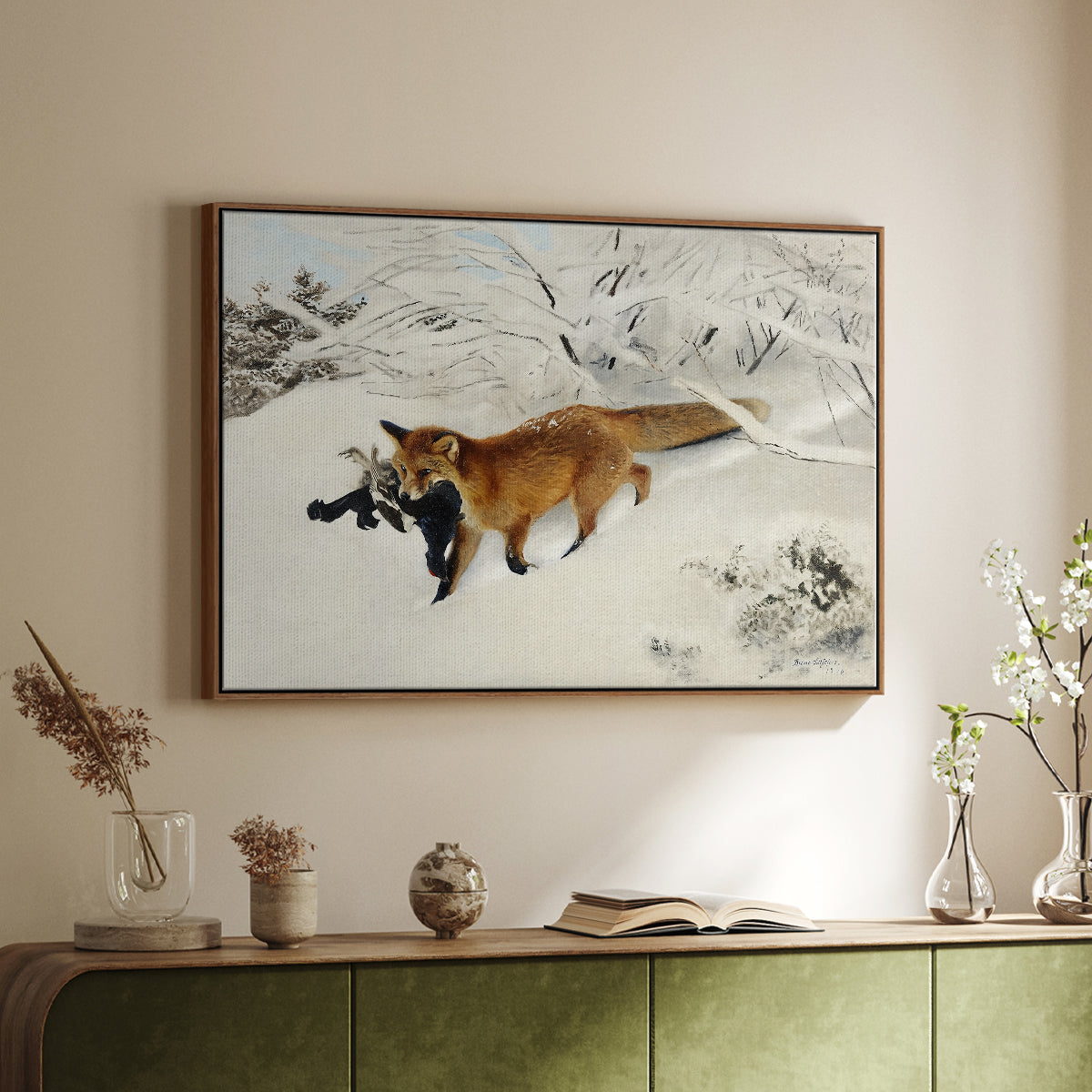 Walnut floater framed canvas of Fox in Snow Landscape, 1900 by Bruno Liljefors, featuring a wildlife scene of fox moving swiftly through winter terrain above a sideboard in a softly lit hallway.