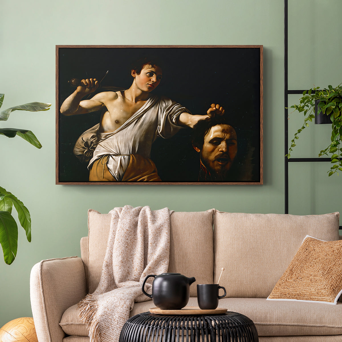 Walnut floater framed canvas featuring an intense religious scene with figure emerging from darkness holding trophy, displayed above a sofa in a modern living room.