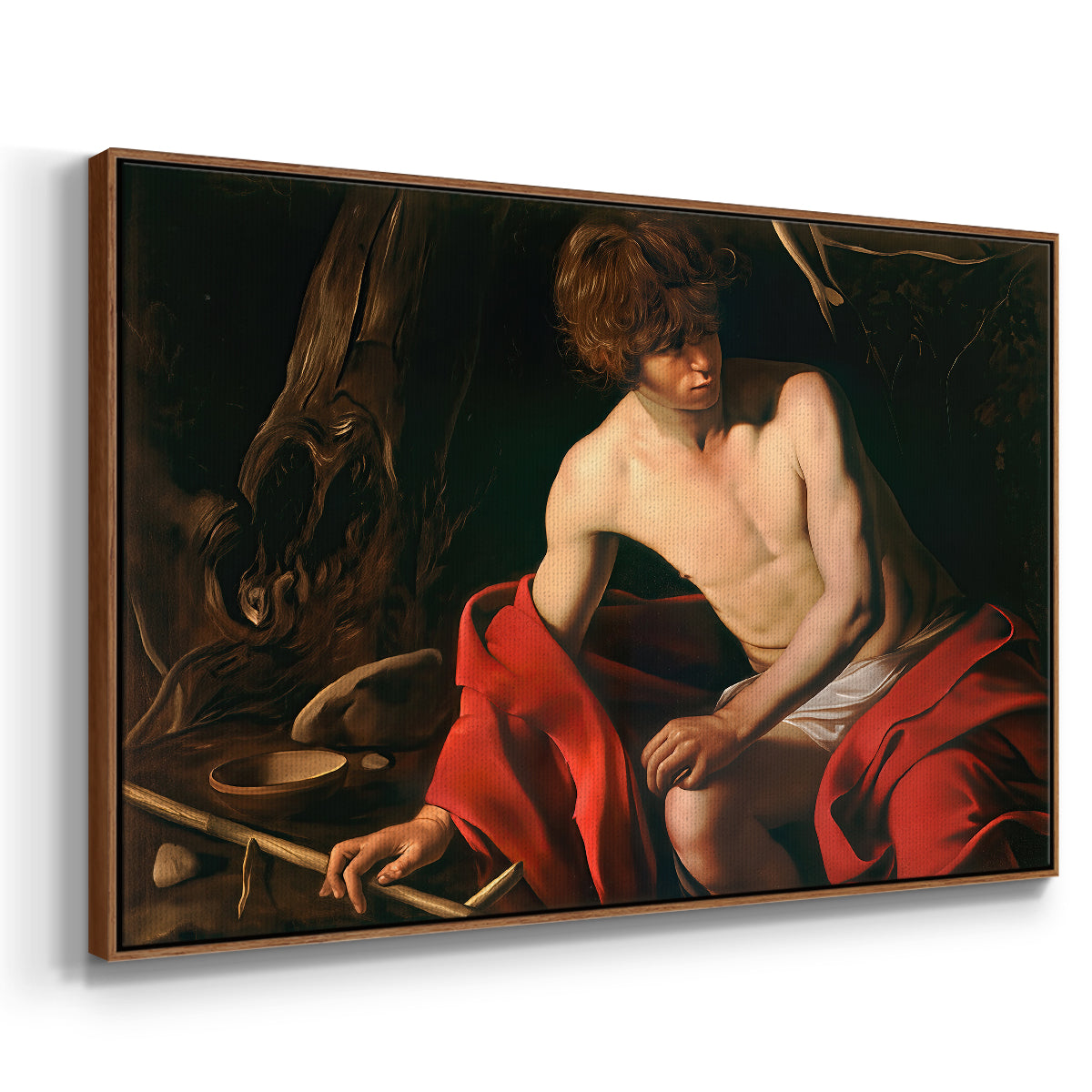 Angled view of Saint John the Baptist in the Wilderness, c. 1603-1604 by Caravaggio in a walnut floater framed canvas.