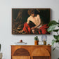 Saint John the Baptist in the Wilderness, c. 1603-1604 by Caravaggio in a walnut floater framed canvas featuring a young Saint John seated in wilderness with staff and red drapery, displayed above a wood console cabinet.