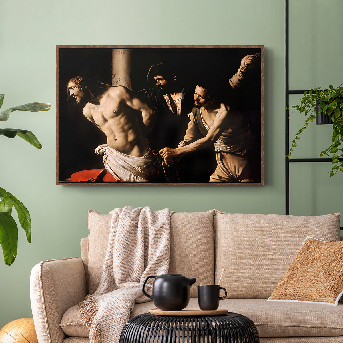 Walnut floater framed canvas featuring an intense Baroque scene of suffering with strong light and shadow, displayed above a sofa in a modern living room.