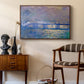 Charing Cross Bridge, 1903 by Claude Monet as a walnut floater framed canvas featuring an atmospheric depiction of London bridge with reflections in water, styled above a mid-century console in a contemporary living area.