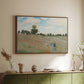 Walnut floater framed canvas of The Poppy Field near Argenteuil, 1873 by Claude Monet, featuring an impressionist countryside scene with flowers and strolling figures above a sideboard in a softly lit hallway.