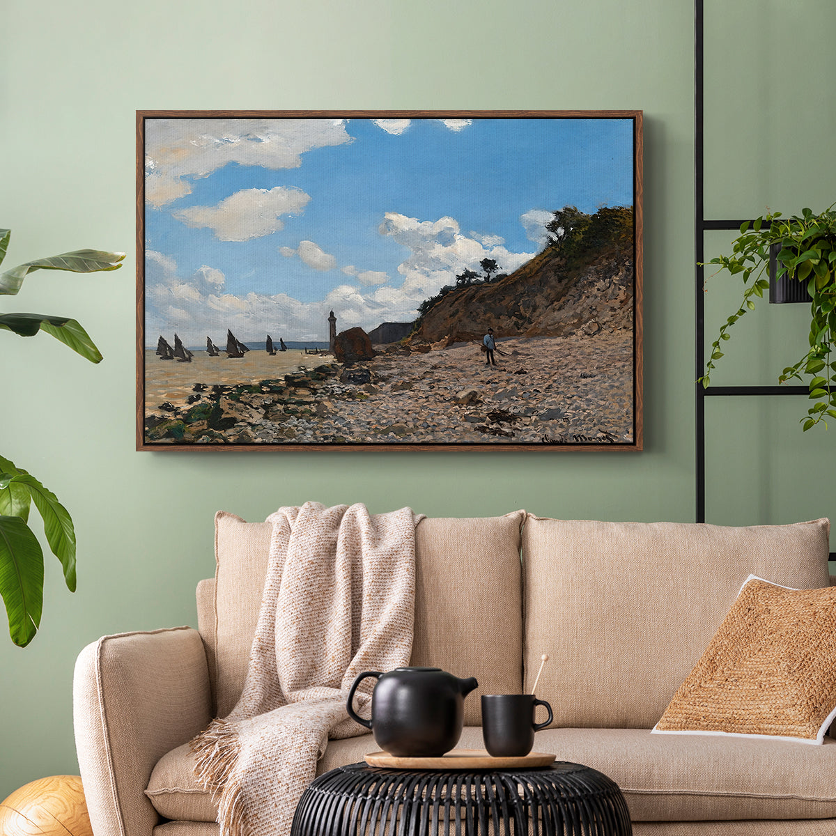 Walnut floater framed canvas featuring a coastal landscape with boats and people along shore, displayed above a sofa in a modern living room.
