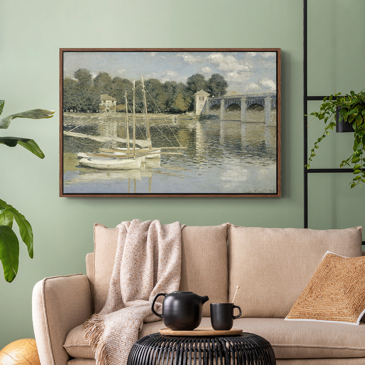 Walnut floater framed canvas featuring a riverside view with architecture and nautical activity, displayed above a sofa in a modern living room.