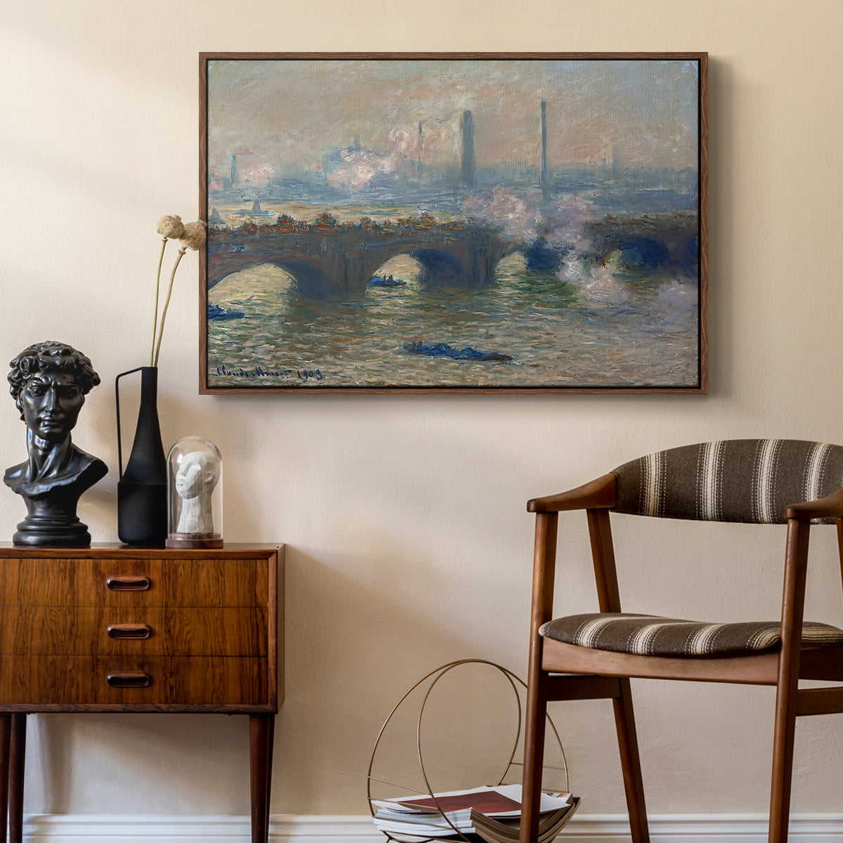 Waterloo Bridge, Gray Day, 1903 by Claude Monet as a walnut floater framed canvas featuring a river and bridge scene with diffused light and urban backdrop, styled above a mid-century console in a contemporary living area.