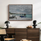 The Beach at Sainte-Adresse, 1867 by Claude Monet displayed in a walnut floater framed canvas above a dark wood credenza in an entryway.