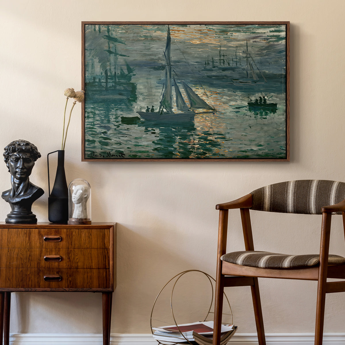 Sunrise (Marine), 1873 by Claude Monet as a walnut floater framed canvas featuring an early morning harbor scene with boats and diffused light, styled above a mid-century console in a contemporary living area.