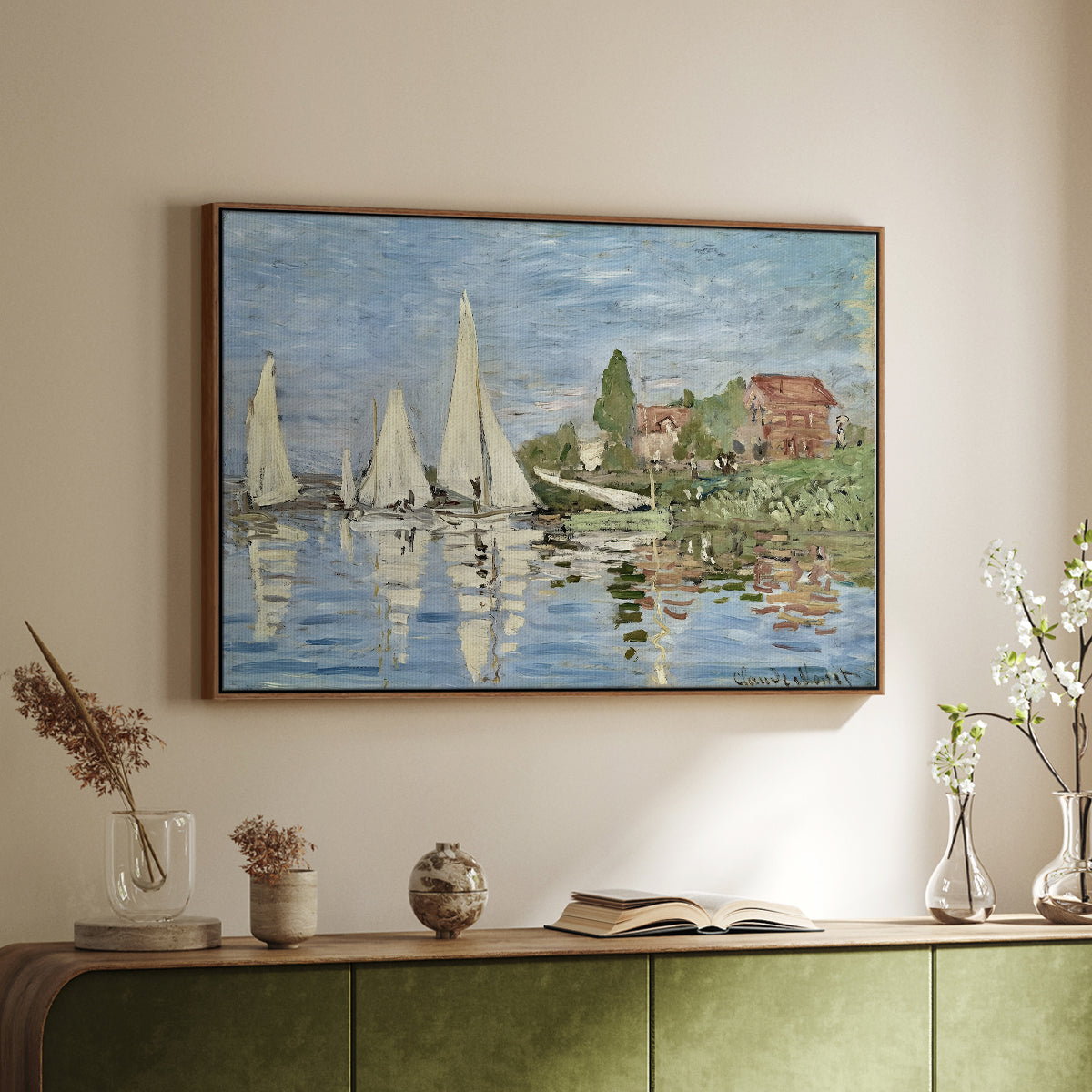Walnut floater framed canvas of Regatta at Argenteuil, 1872 by Claude Monet, featuring a lively regatta scene with multiple boats and fluttering sails above a sideboard in a softly lit hallway.