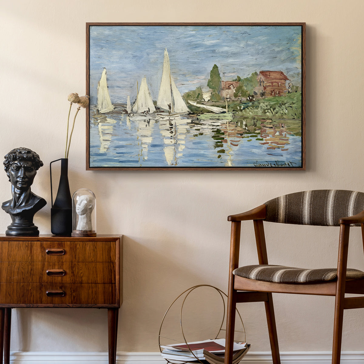 Regatta at Argenteuil, 1872 by Claude Monet as a walnut floater framed canvas featuring an impressionist depiction of sailing competition on water, styled above a mid-century console in a contemporary living area.