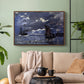 Walnut floater framed canvas featuring an atmospheric maritime view with ships in moonlit darkness, displayed above a sofa in a modern living room.