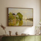 Walnut floater framed canvas of Houses on the Achterzaan, 1871 by Claude Monet, featuring riverside homes with trees and mirrored reflections in water above a sideboard in a softly lit hallway.
