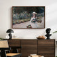 Young Girl in the Garden at Giverny, 1888 by Claude Monet displayed in a walnut floater framed canvas above a dark wood credenza in an entryway.