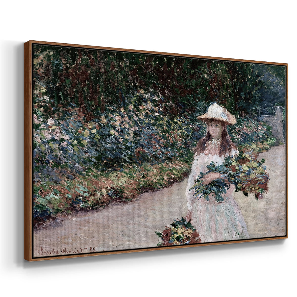 Angled view of Young Girl in the Garden at Giverny, 1888 by Claude Monet in a walnut floater framed canvas.