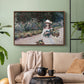 Walnut floater framed canvas featuring a tranquil outdoor portrait of girl in floral setting, displayed above a sofa in a modern living room.