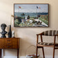 Garden at Sainte-Adresse, 1867 by Claude Monet as a walnut floater framed canvas featuring a vibrant garden scene with colorful blooms and distant sea, styled above a mid-century console in a contemporary living area.