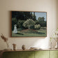 Walnut floater framed canvas of Woman in the Garden, Sainte-Adresse, 1867 by Claude Monet, featuring an impressionist figure in sunlit garden with lush vegetation above a sideboard in a softly lit hallway.