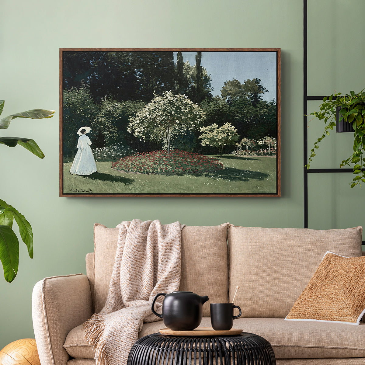 Walnut floater framed canvas featuring a tranquil garden portrait with soft natural light, displayed above a sofa in a modern living room.