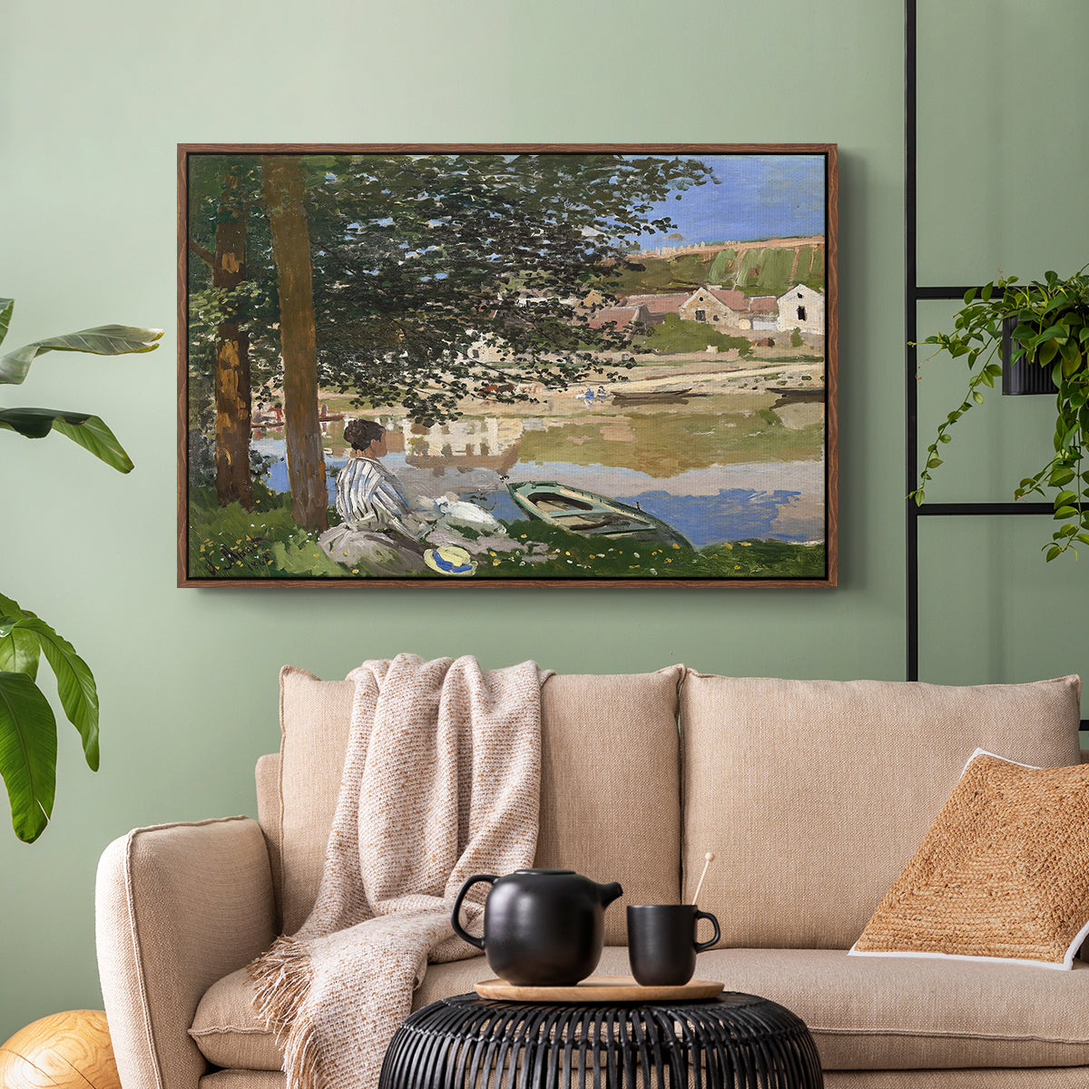 Walnut floater framed canvas featuring a quiet outdoor setting with figures near river under foliage, displayed above a sofa in a modern living room.