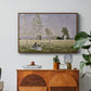 Summer (L'ete), 1874 by Claude Monet in a walnut floater framed canvas featuring a woman seated in grassy field beneath tree in bright summer landscape, displayed above a wood console cabinet.
