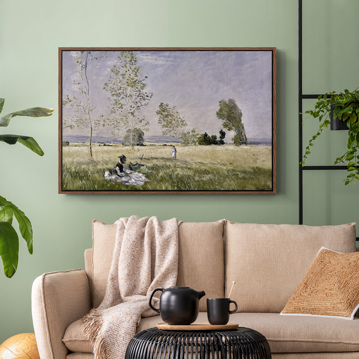 Walnut floater framed canvas featuring a tranquil summer landscape with lone figure in nature, displayed above a sofa in a modern living room.
