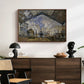 The Gare Saint-Lazare, 1877 by Claude Monet displayed in a walnut floater framed canvas above a dark wood credenza in an entryway.