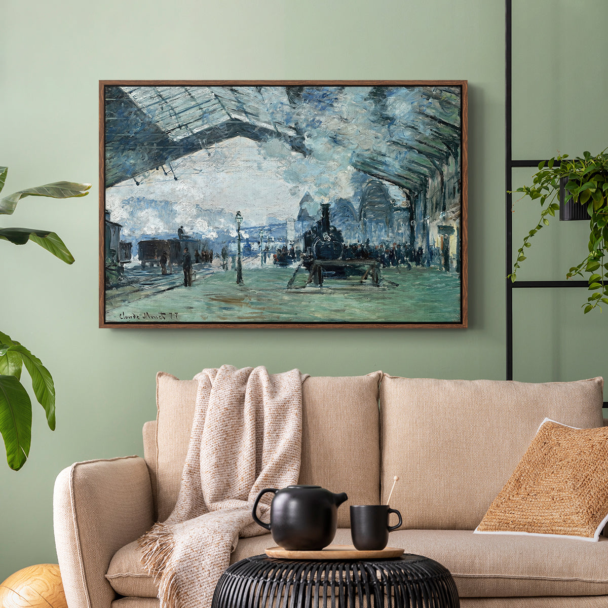 Walnut floater framed canvas featuring a dramatic depiction of industrial space with trains and light, displayed above a sofa in a modern living room.