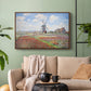 Walnut floater framed canvas featuring a rural scene with patterned rows of flowers and windmill, displayed above a sofa in a modern living room.