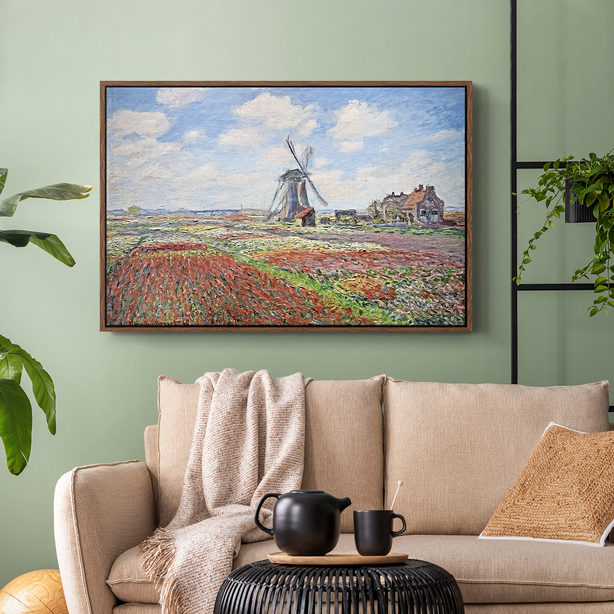 Walnut floater framed canvas featuring a rural scene with patterned rows of flowers and windmill, displayed above a sofa in a modern living room.