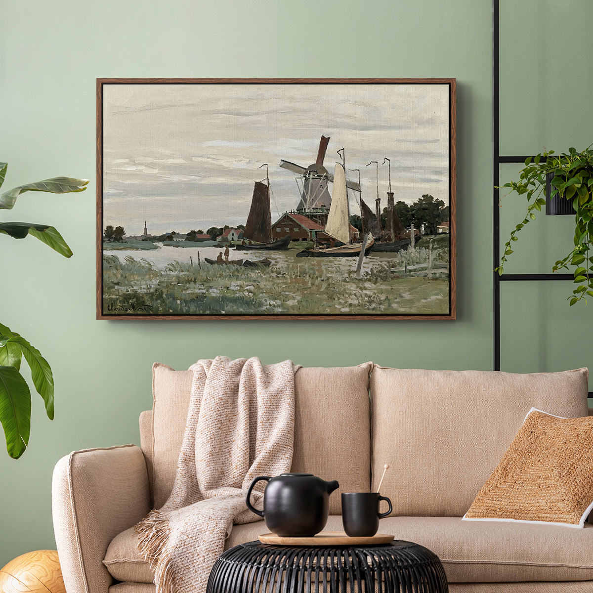 Walnut floater framed canvas featuring a countryside structure standing against open sky, displayed above a sofa in a modern living room.