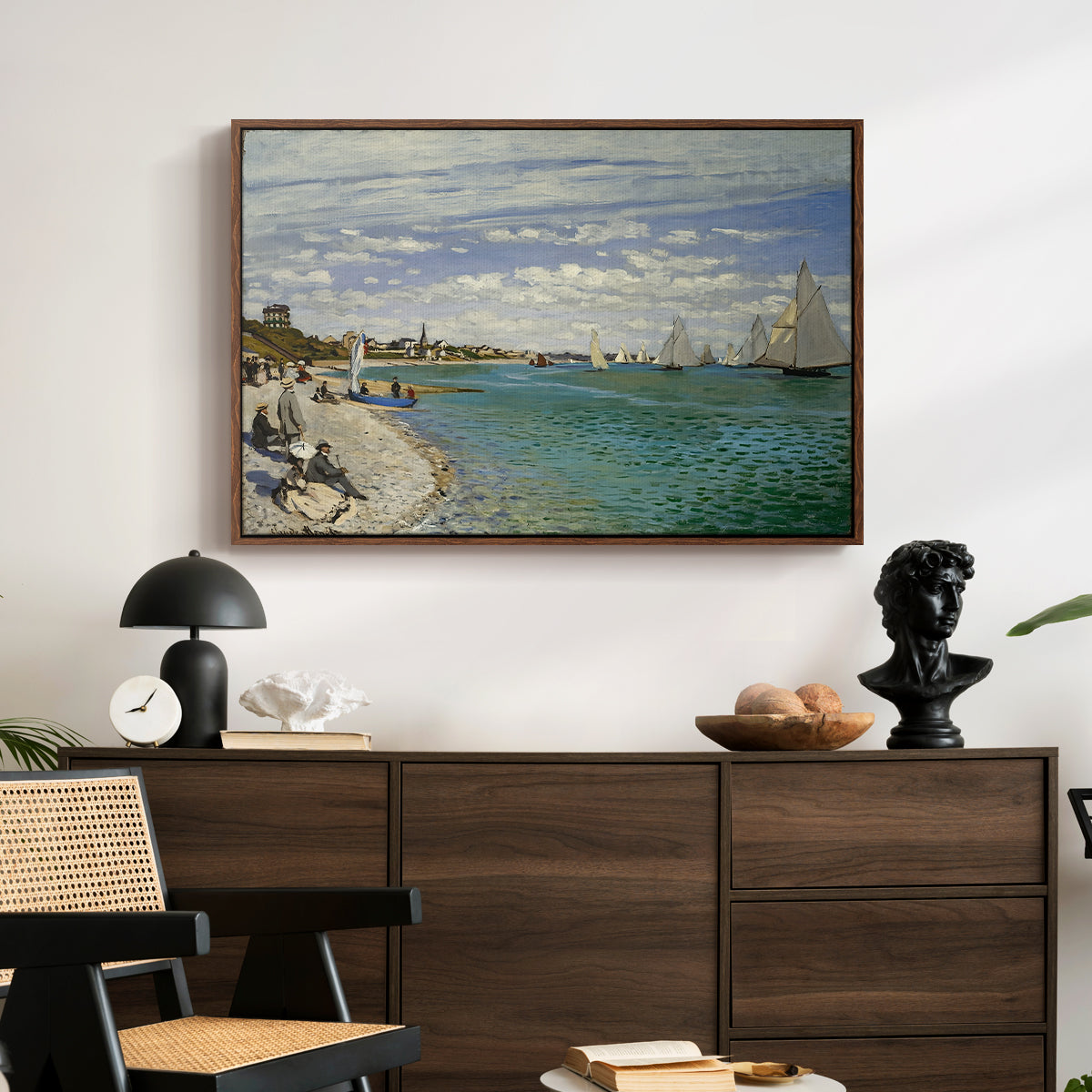 Regatta at Sainte-Adresse, 1867 by Claude Monet displayed in a walnut floater framed canvas above a dark wood credenza in an entryway.