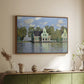 Walnut floater framed canvas of Houses on the Zaan River at Zaandam, 1871 by Claude Monet, featuring an impressionist riverside village with colorful buildings above a sideboard in a softly lit hallway.