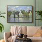 Walnut floater framed canvas featuring a waterfront architecture with still reflections, displayed above a sofa in a modern living room.