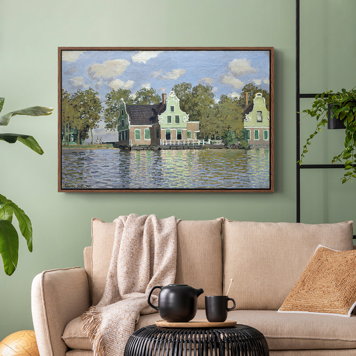 Walnut floater framed canvas featuring a waterfront architecture with still reflections, displayed above a sofa in a modern living room.