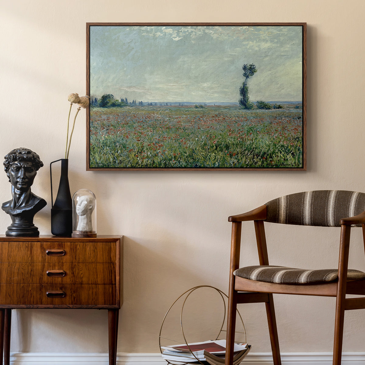 Poppy Field, 1881 by Claude Monet as a walnut floater framed canvas featuring a rural meadow with scattered poppies and soft horizon, styled above a mid-century console in a contemporary living area.