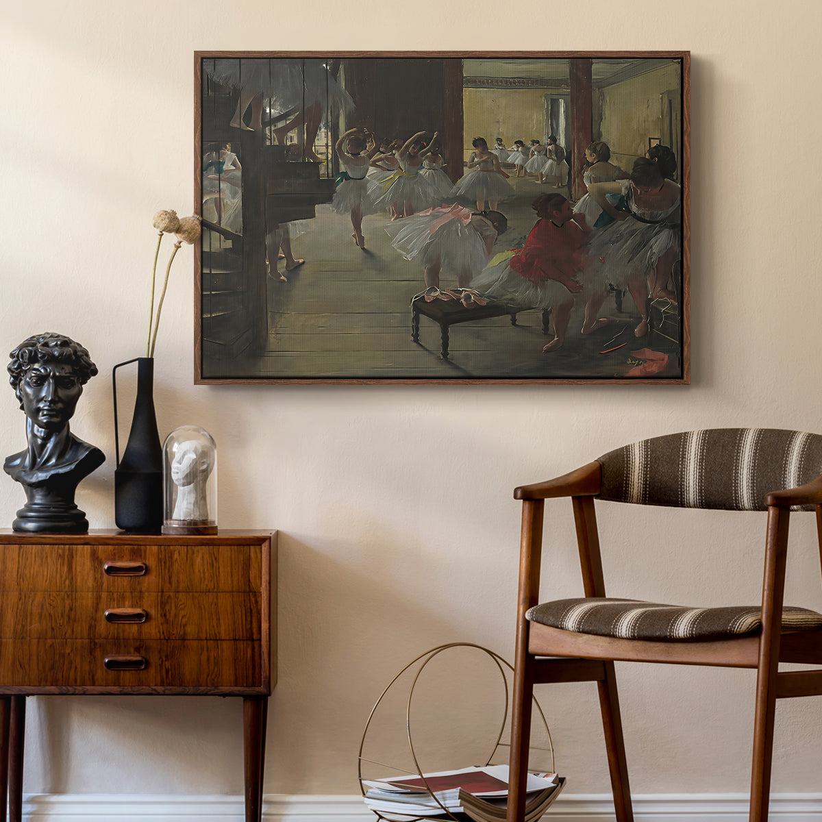 The Dance Class, c. 1873 by Edgar Degas as a walnut floater framed canvas featuring an impressionist studio interior filled with ballet students, styled above a mid-century console in a contemporary living area.