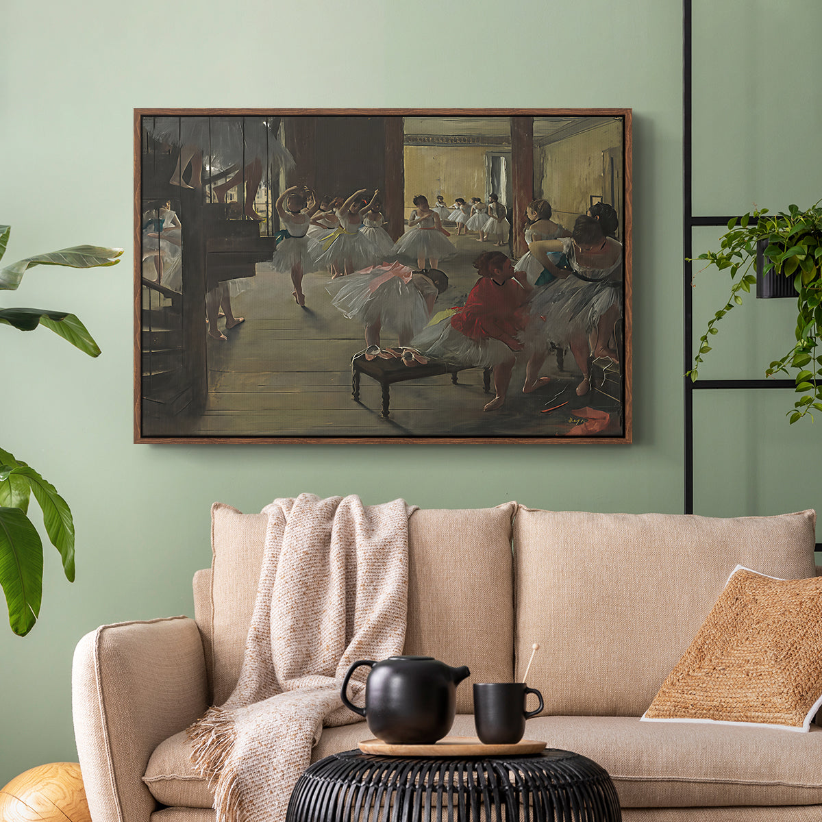 Walnut floater framed canvas featuring a group of dancers preparing during class with natural light, displayed above a sofa in a modern living room.