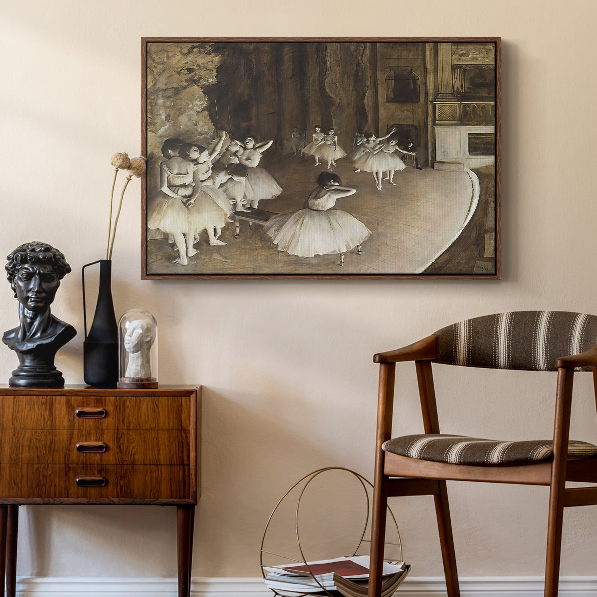 The Rehearsal of the Ballet Onstage, 1874 by Edgar Degas as a walnut floater framed canvas featuring an impressionist depiction of ballet practice on theater stage, styled above a mid-century console in a contemporary living area.