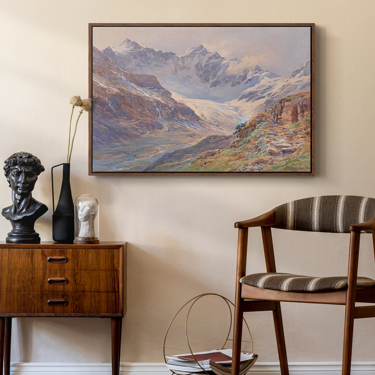 Odenwinklkees with the Johannisberg, 1902 by Edward Theodore Compton as a walnut floater framed canvas featuring a realistic depiction of high-altitude snowy peaks, styled above a mid-century console in a contemporary living area.