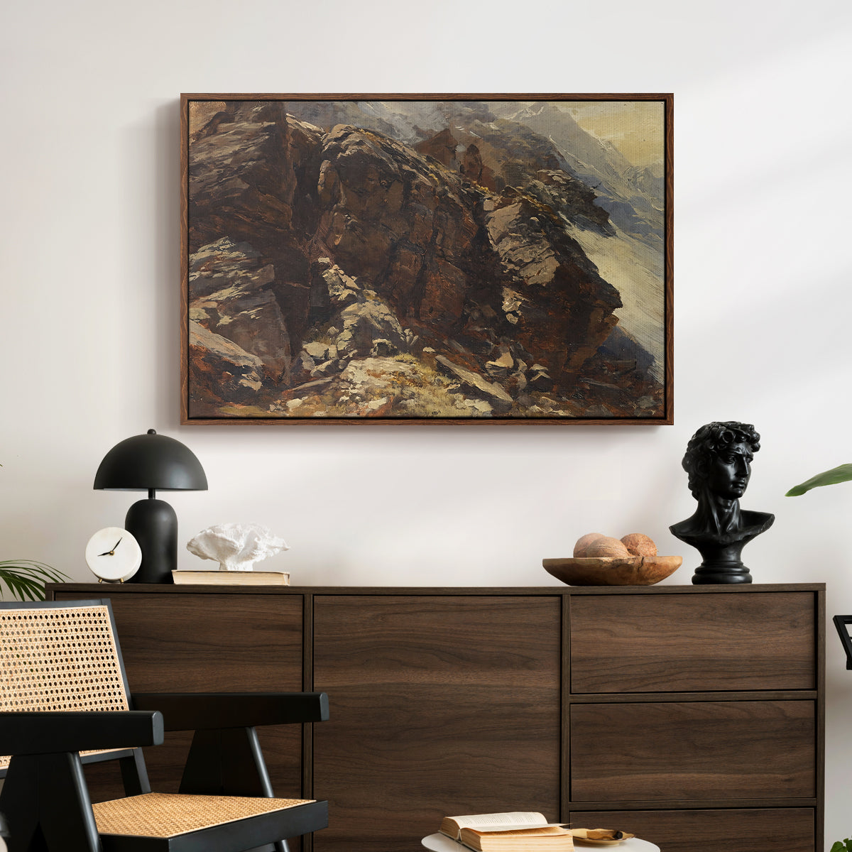 High Mountain Study, c. 1870 by Edward Theodore Compton displayed in a walnut floater framed canvas above a dark wood credenza in an entryway.