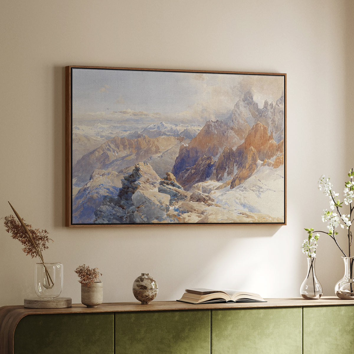 Walnut floater framed canvas of Col du Géant, 1903 by Edward Theodore Compton, featuring a high mountain landscape featuring dramatic ridges and glacier terrain above a sideboard in a softly lit hallway.