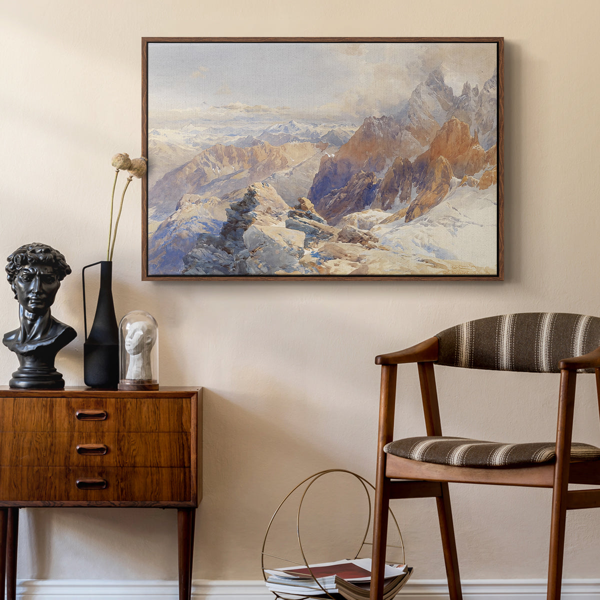 Col du Géant, 1903 by Edward Theodore Compton as a walnut floater framed canvas featuring a panoramic alpine view with snow and rocky cliffs, styled above a mid-century console in a contemporary living area.