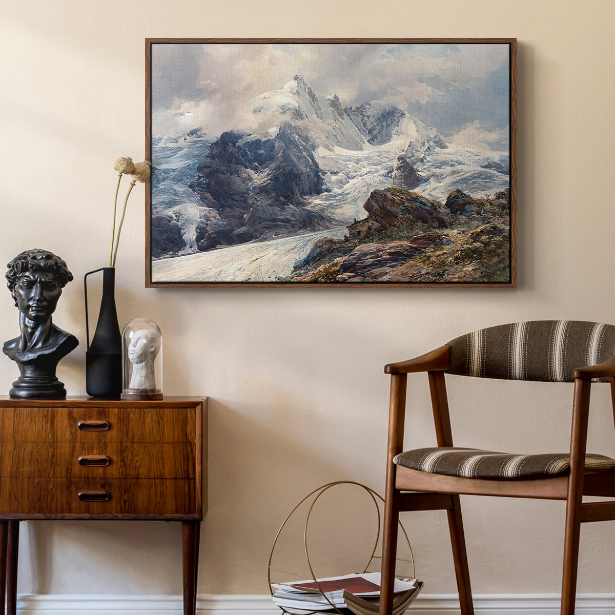 The Grossglockner, 1880 by Edward Theodore Compton as a walnut floater framed canvas featuring a realistic landscape of high mountain under open sky, styled above a mid-century console in a contemporary living area.